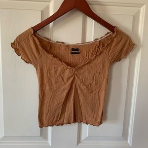 Nude cropped off the shoulder tee
